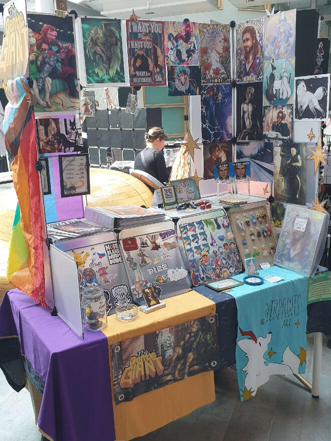 the artist alley table of the gentle giant & deerprints art during Närcon summer 2025